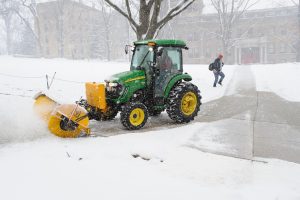 campus tractor clearing sidewalks on Bascom Hill