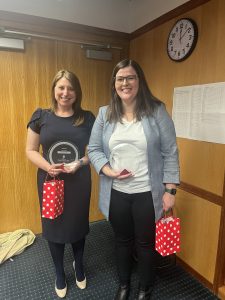Emily Kite and Lauren Devine posing with their access awards at the Law School