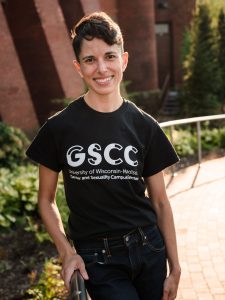 Katherine Charek Briggs posing outside a campus academic building