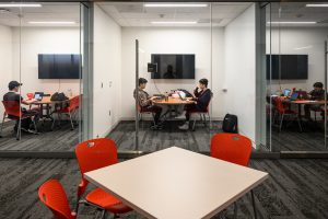 Students studying in a small private room.
